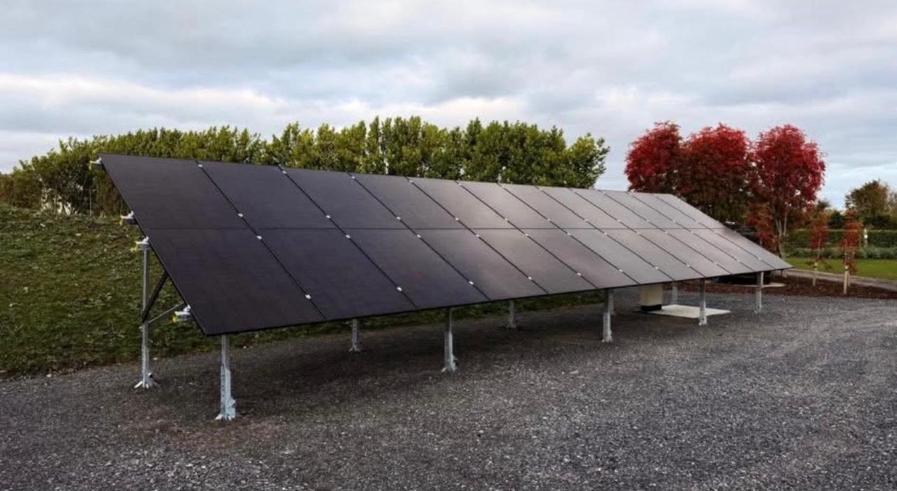 Aerial view of commercial building with rooftop solar array